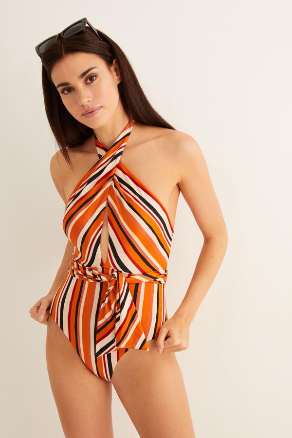 Bañador naranja con rayas y escote cruzado, de Women'secret, (31,99 euros).