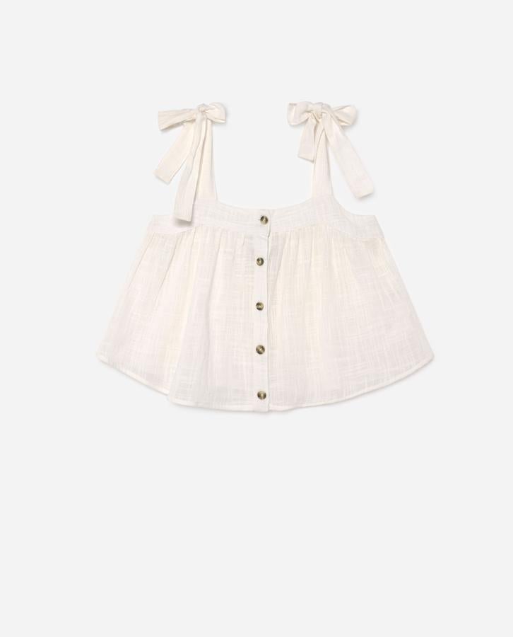 Top blanco con botones de Lefties, (4,99 euros).