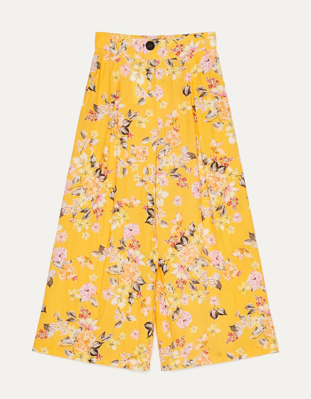 Pantalones amarillos con estampado de flores. (25,99 euros).