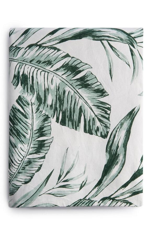 En color blanco con estampado de hojas en color verde, este mantel tiene un precio de 8 euros.
