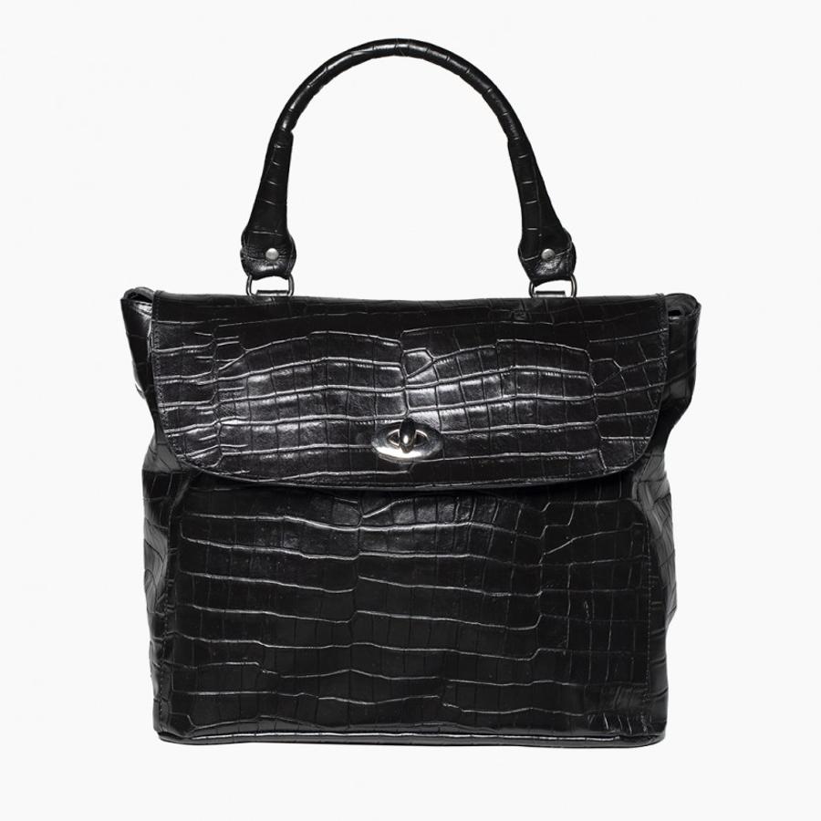 MARDI&GRASS es una firma de accesorios de piel fabricados en España, donde cada pieza es única, se fabrica manualmente y en tiradas cortas, conservando las técnicas más tradicionales de trabajo de la piel. Este bolso grabado es uno de nuestros favoritos (159 euros).