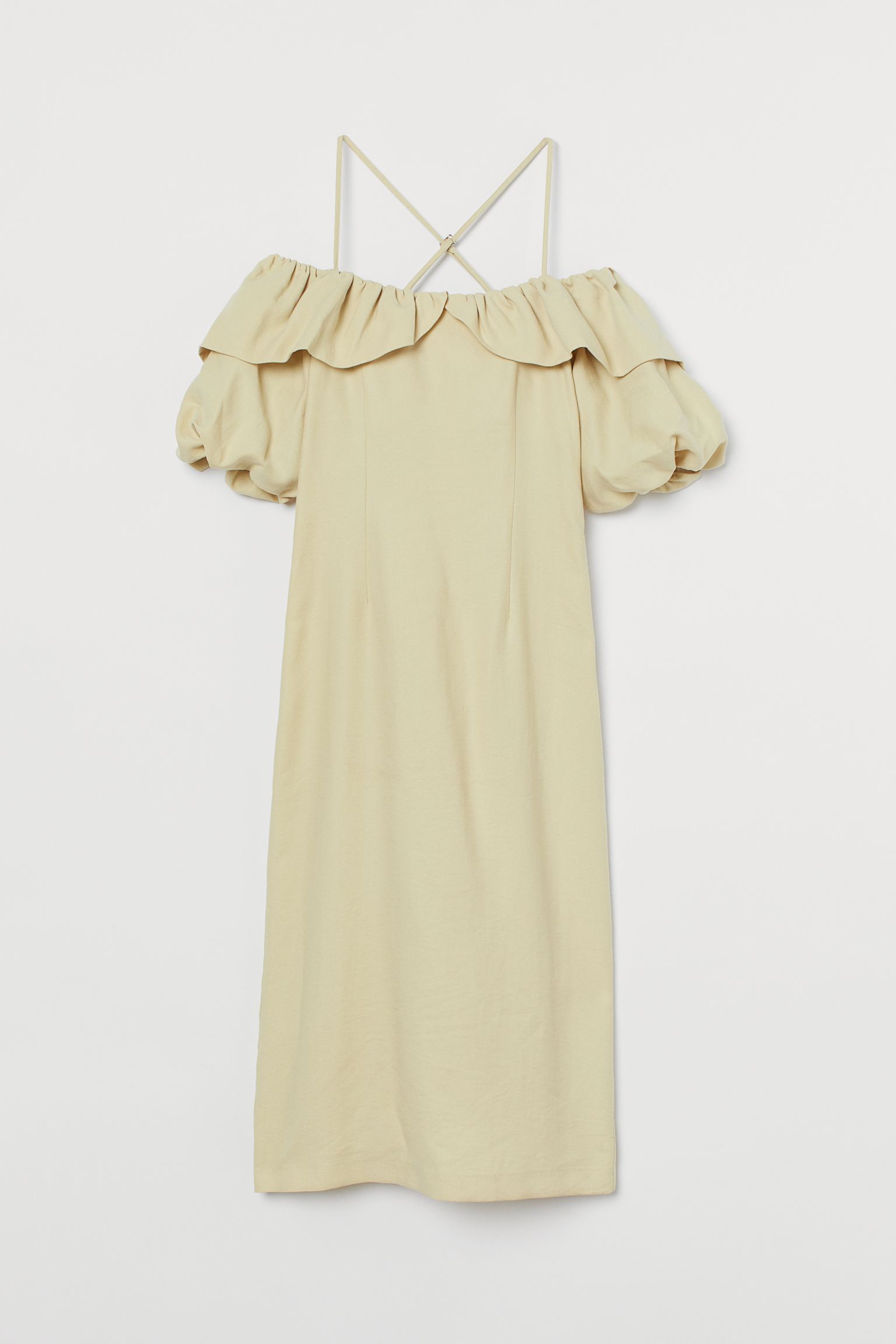 Para salir de lo habitual... vestido con mezcla de lyocell, hombros al descubierto, tirantes cruzados y mangas globo en uno de los colores pastel que triunfarán esta primavera, el amarillo. (49,99 euros).