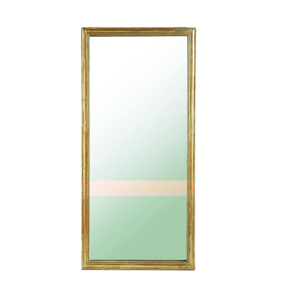 Espejo Afsan, con madera de mango dorado, de La Redoute (389 €).