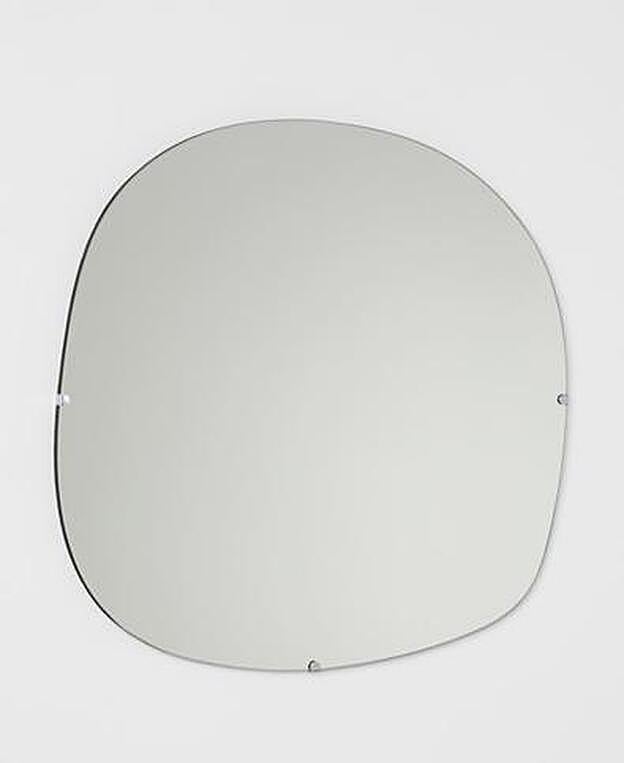 Espejo de pared ovalado de H&M Home.