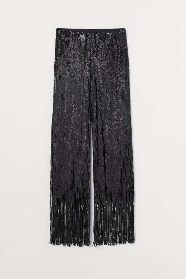 Pantalón en malla de lentejuelas acabado en flecos color negro, de la Studio Collection.