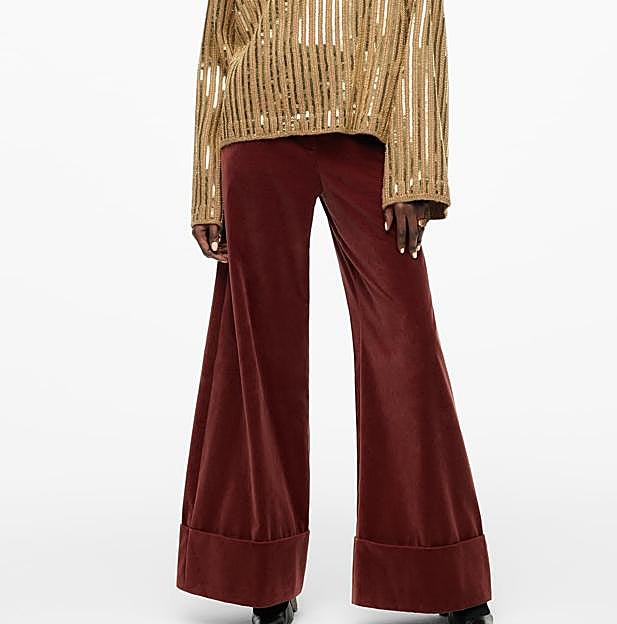 Imagen principal - 1. Pantalón fluido de tercipelo burdeos de Zara (69,99 euros). 2. Pantalón negro de terciopelo de Zara (39,99 euros). 3. Pantalón con estampado de flores de Zara (29,99 euros). 