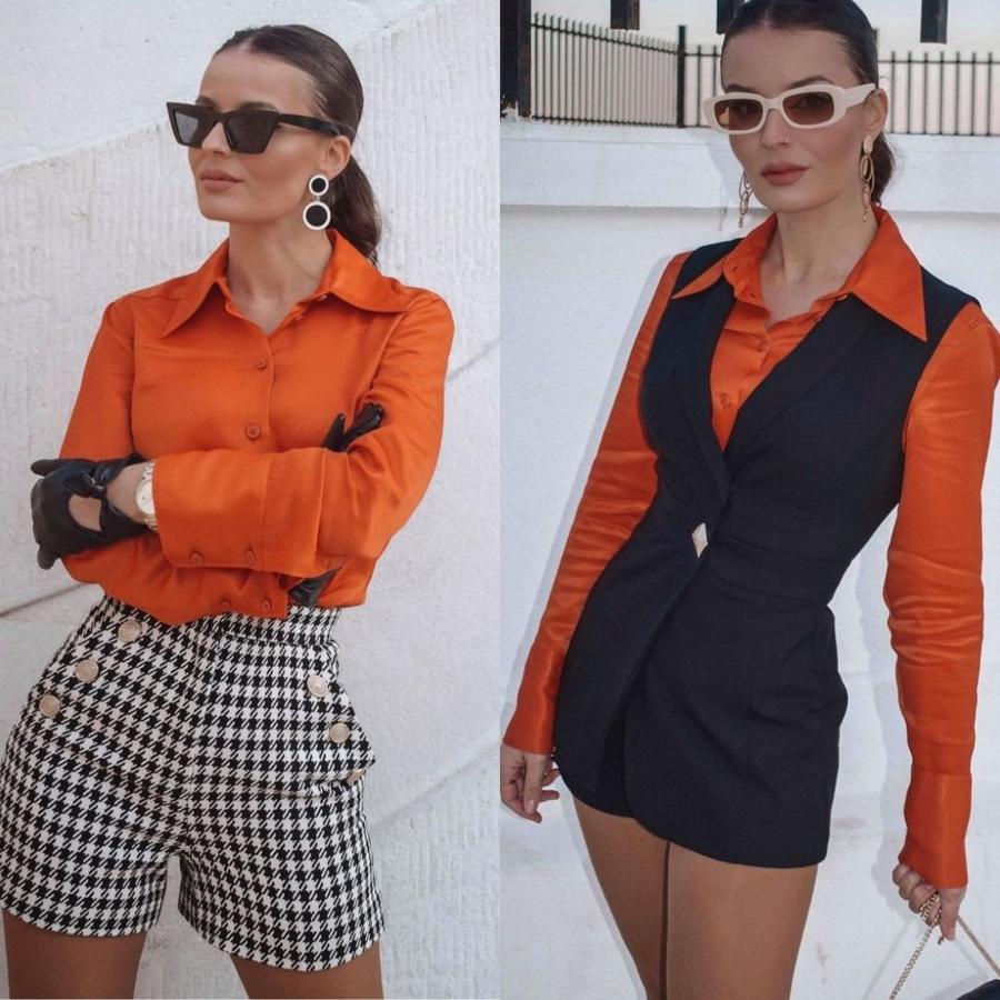 ¿Un básico con el que unirte a la tendencia del naranja? Con la camisa satinada de cuello solapa, manga larga acabada en puño y bajo asimétrico. Cuesta 29,95 euros.