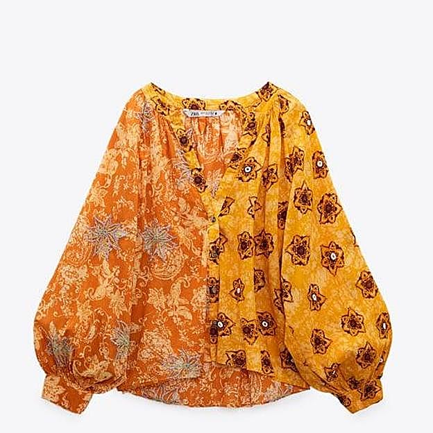 La blusa de algodón