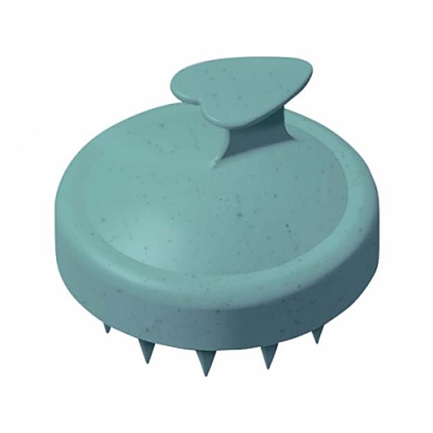 El cepillo masajeador del cuero cabelludo.