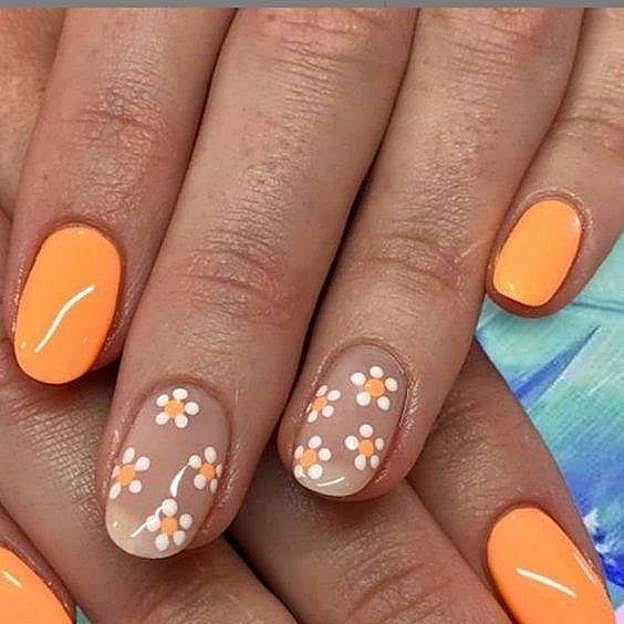 Manicura con margaritas y tonos cítricos neón
