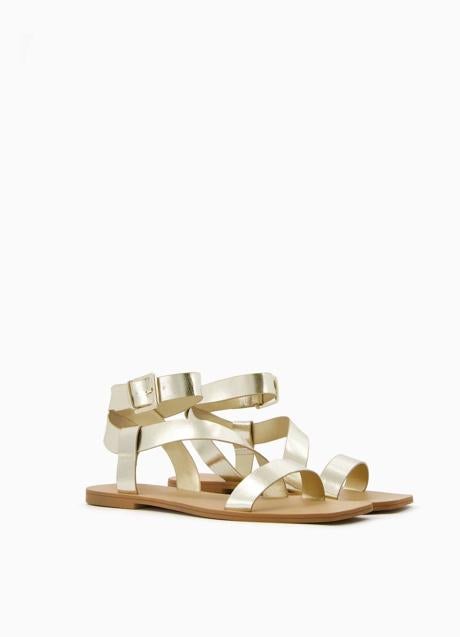 Imagen - Sandalias doradas con cierre de pulsera al tobillo