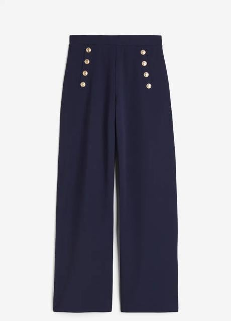 Imagen - Pantalón ancho en color azul marino con botones dorados de H&M (19,99 euros)