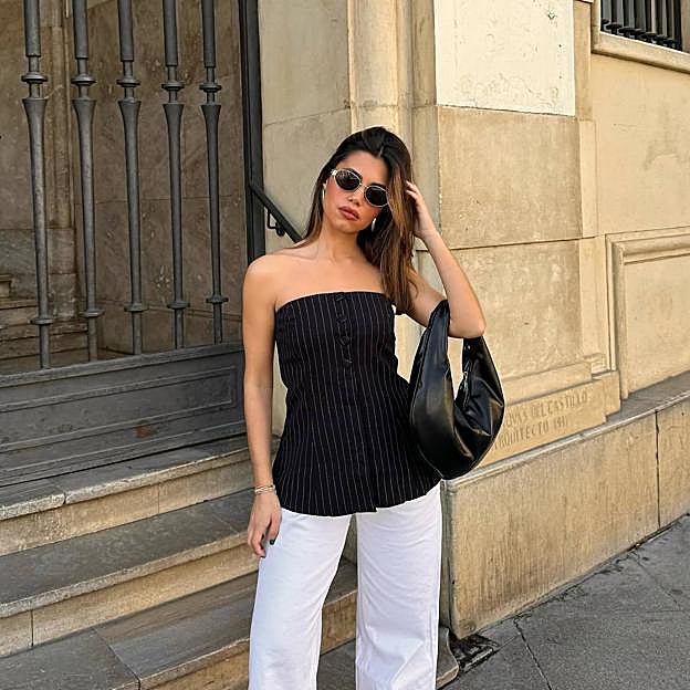 Los tops palabra de honor de moda que han conquistado a las influencers para vestir con estilo