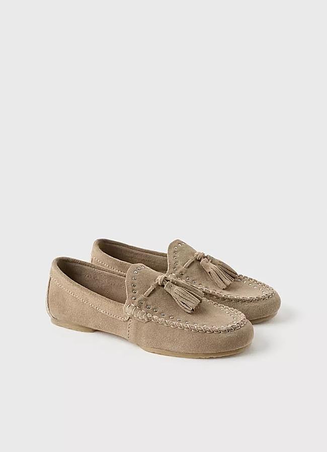 Imagen - Mocasines en piel con tachas de Zara Z3D (35,95 euros).