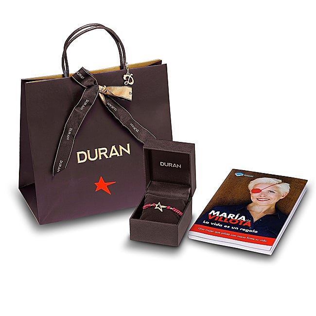 La pulsera solidaria y el libro de María de Villota.