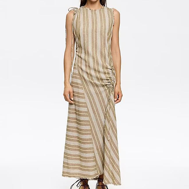 Vestido largo de lino en tono natural de Bimba y Lola, 123,70 euros.