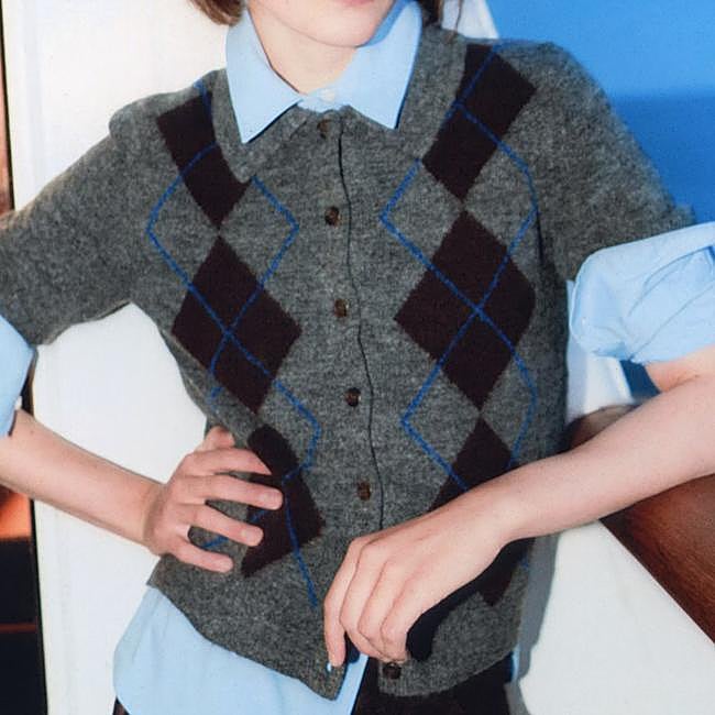 Cárdigan de cuadros, 27,99 euros.