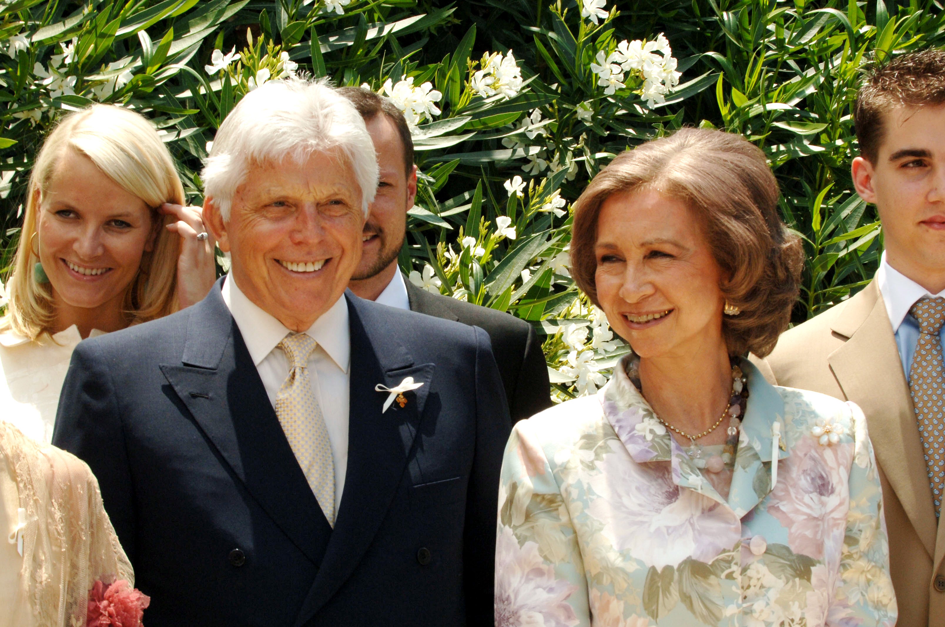 Robert Warren Miller junto a la reina Sofía en el bautizo de su nieto Odisseas.