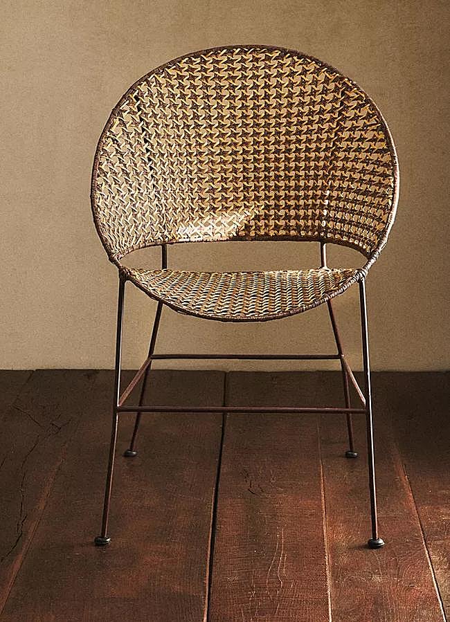 Imagen - Silla de estilo vintage en ratán trenzado, rebajada a 99.99 euros en Zara Home.