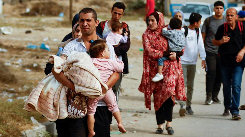 A family flees bombing in northern Gaza.