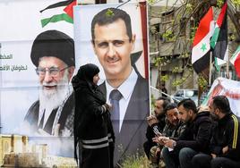 Retratos del presidente sirio, Bashar al-Assad, y del ayatolá iraní Ali Jamenei en Damasco.