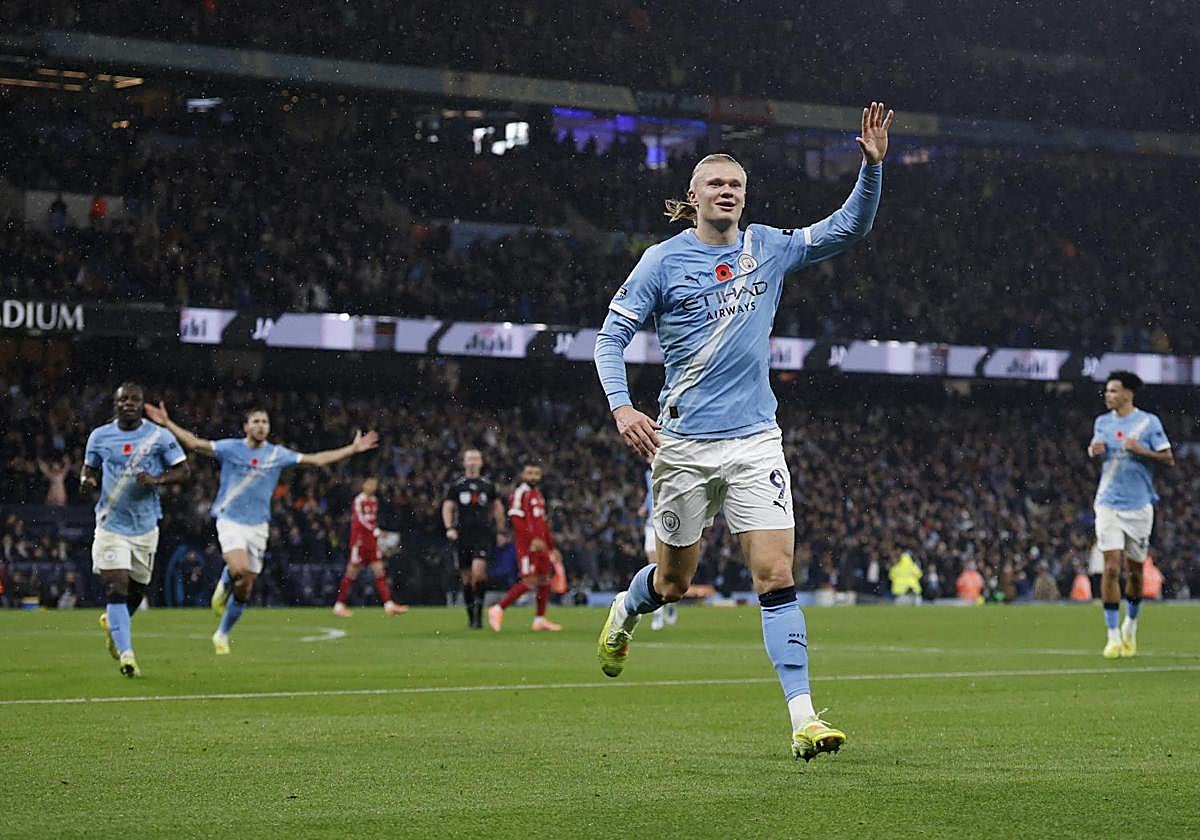 City players celebrate Haaland's goal against Liverpool.