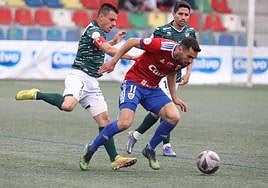 Piojo y Cristóbal, durante el último partido liguero del CD Guijuelo.