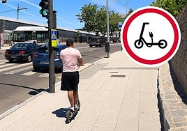 Usuario de un patinete circulando por una acera y nueva señal de prohibición.