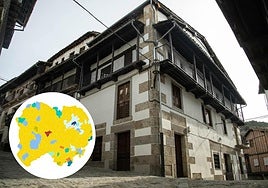 Gran edificio de Candelario y, a la izquierda, el mapa de Salamanca con los años mayoritarios de construcción de los edificios de los municipios salmantinos.