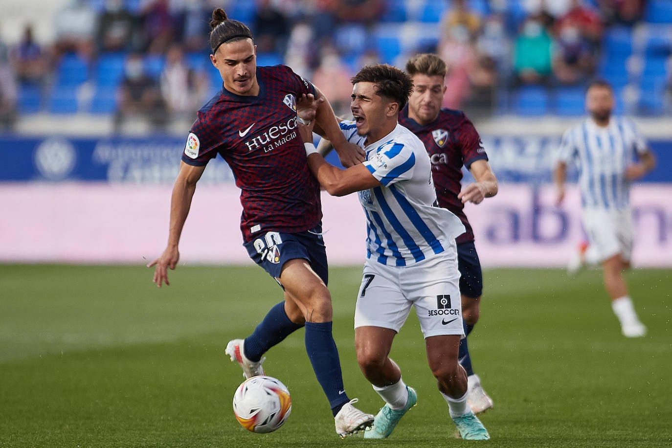 Malaga brought a point home from the El Alcoraz stadium. 