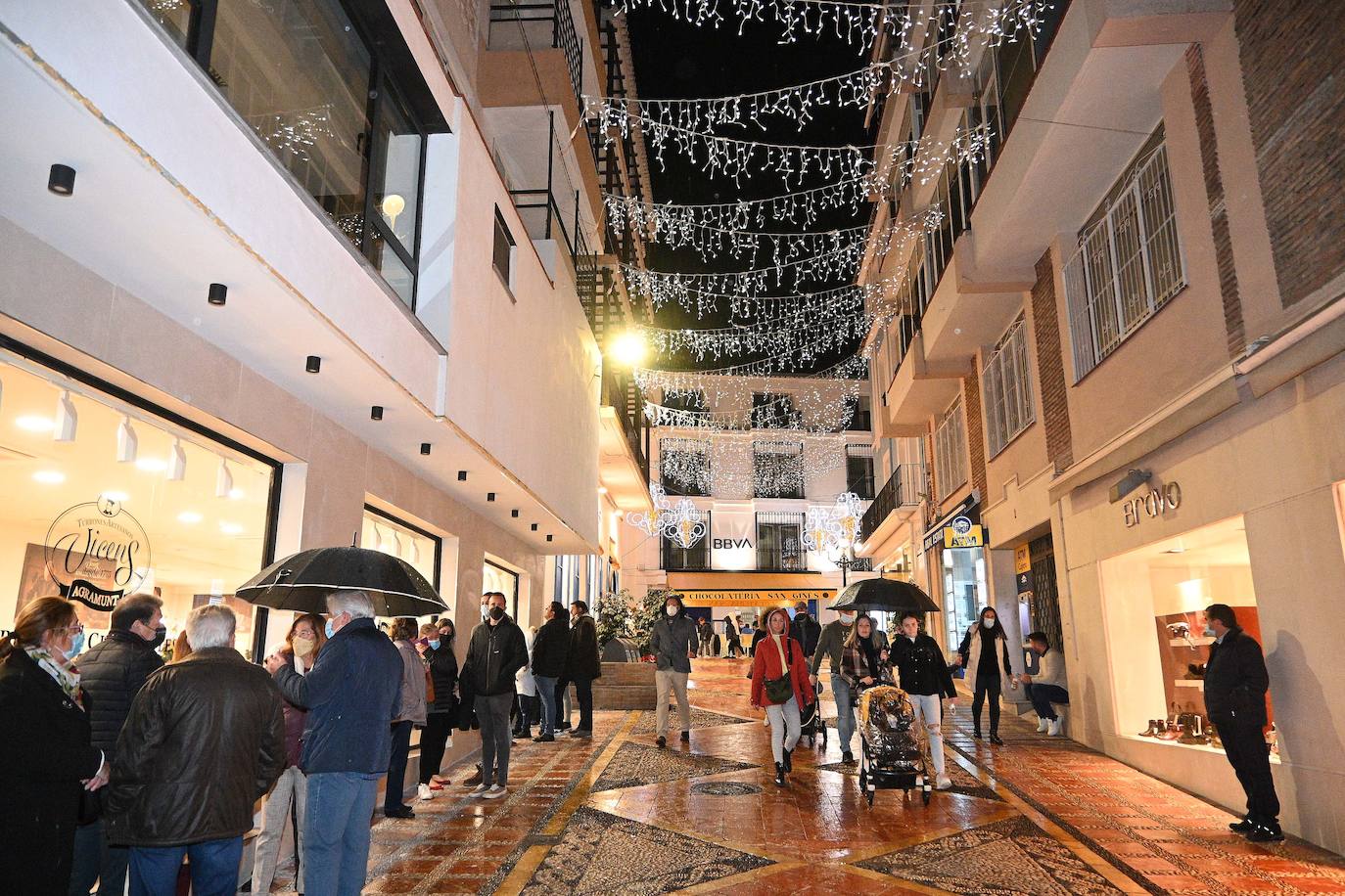 Crowds gathered at Marbella's Christmas lights despite the threat of rain.