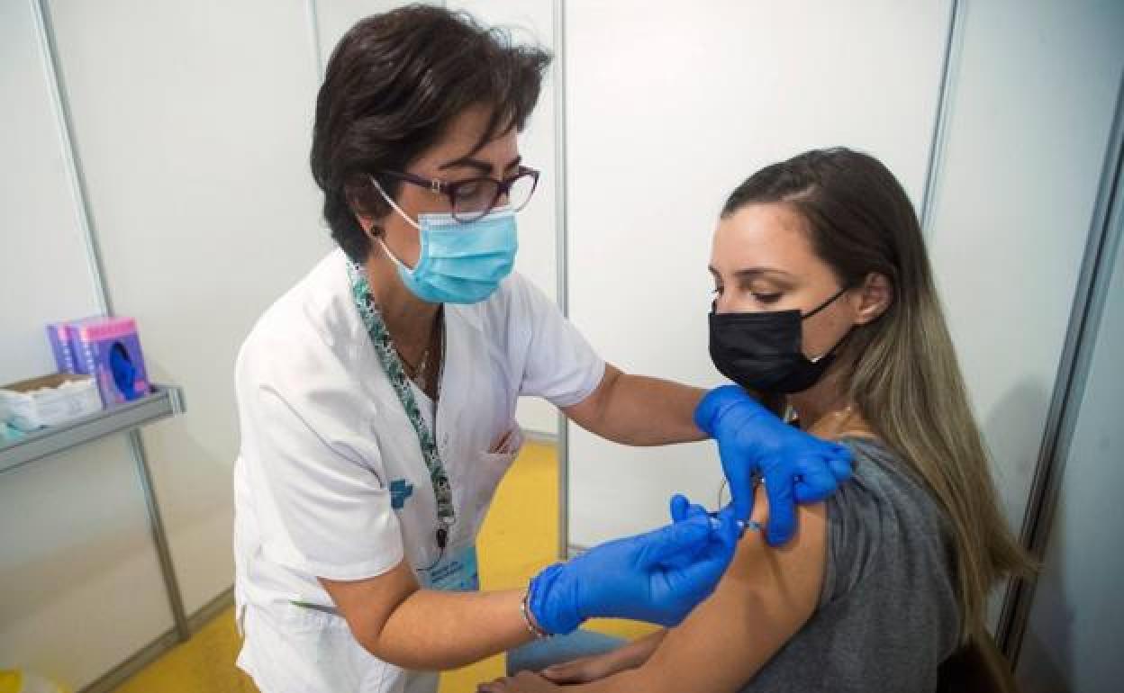A Spanish teenager is vaccinated in Barcelona.