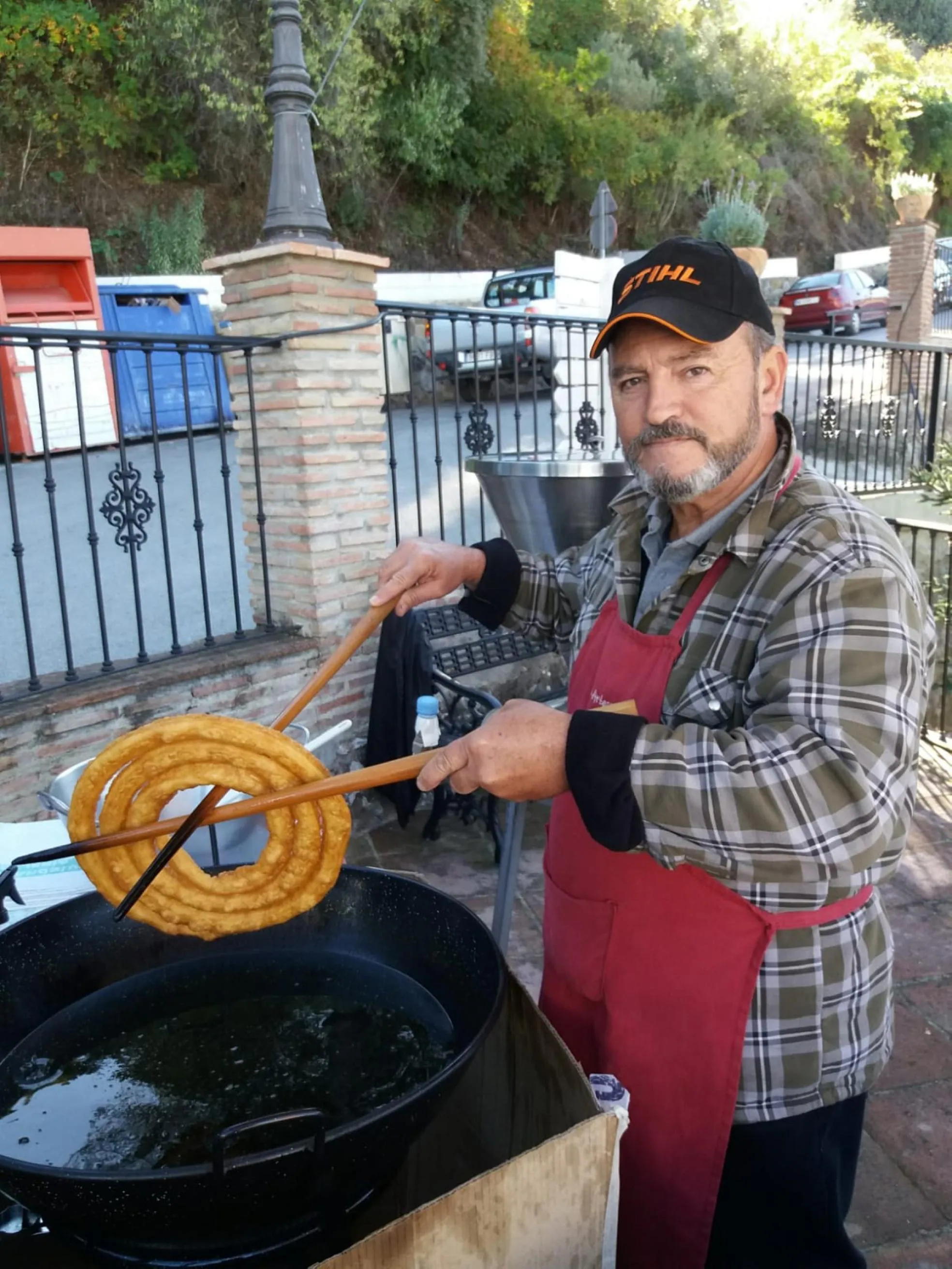 Pedro Ruiz making churros in Júzcar. 