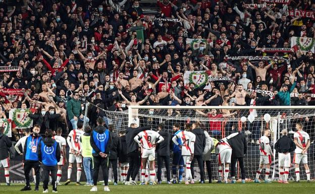Rayo Vallecano fans celebrate with their team's players after beating Mallorca in the Copa del Rey. 