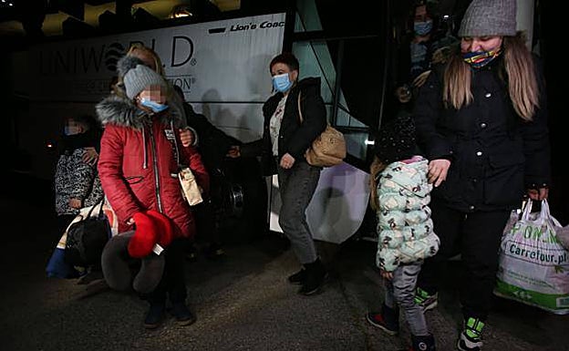 The mothers and children arrived late at night on a bus chartered by a local man. 