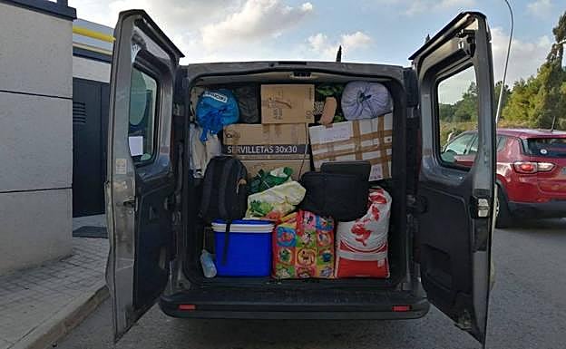 The vans are loaded with humanitarian aid and will return with refugees. 