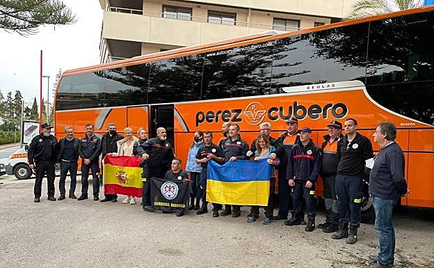 The six firefighters with wellwishers, just before they set off on Tuesday. 