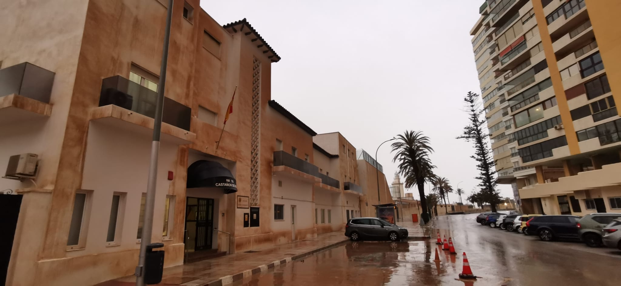 Malaga wakes to cars, buildings and streets covered in red mud