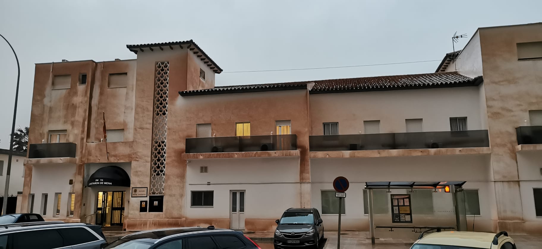 Malaga wakes to cars, buildings and streets covered in red mud