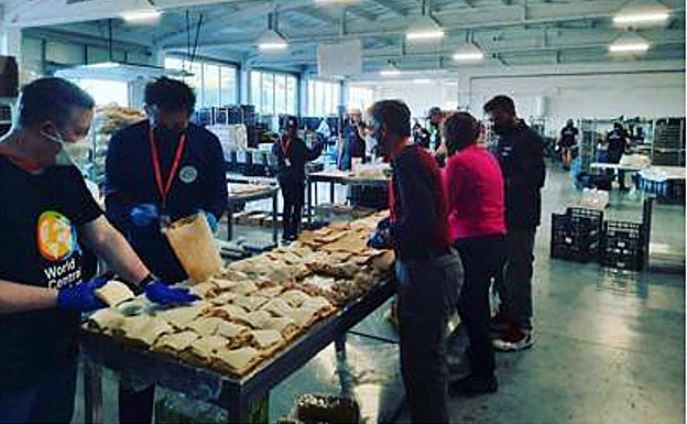 Volunteers prepare sandwiches in the kitchens 