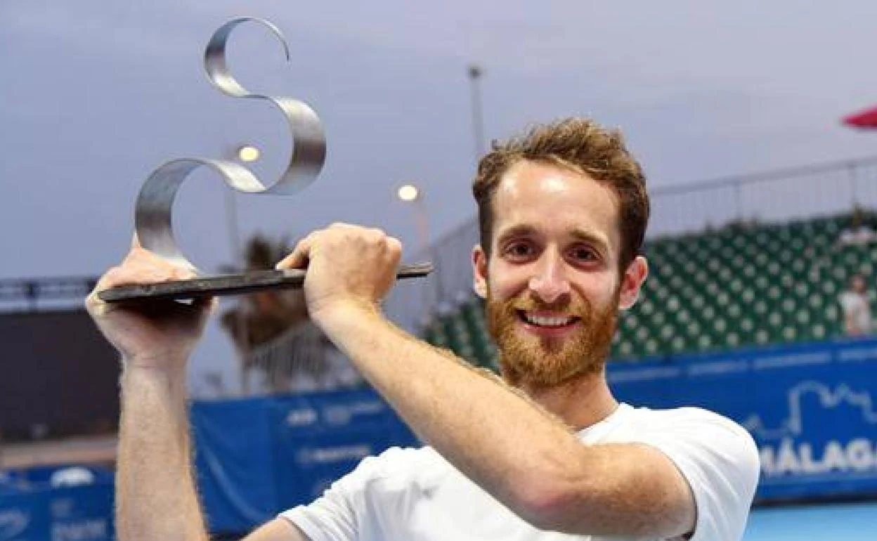 Constant Lestienne poses with the Malaga Open trophy. 