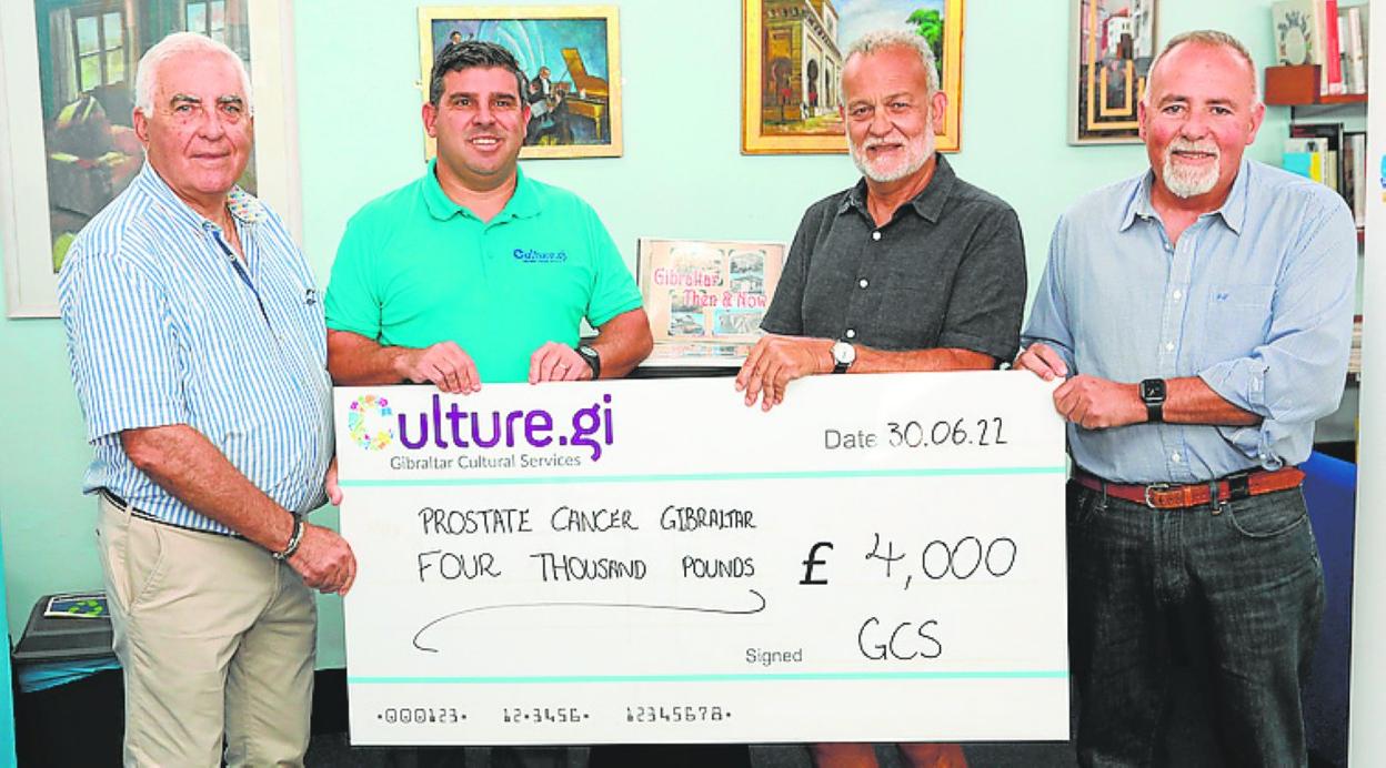 The cheque for £4,000, presented to the charity . 