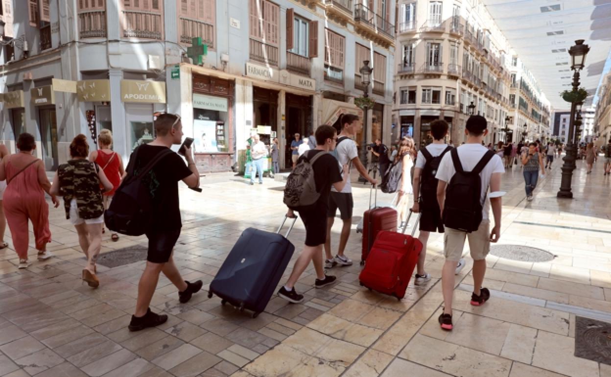 Tourists in Malaga city centre. 