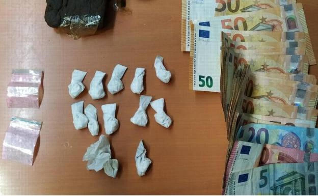 Drugs and cash found during the search. 