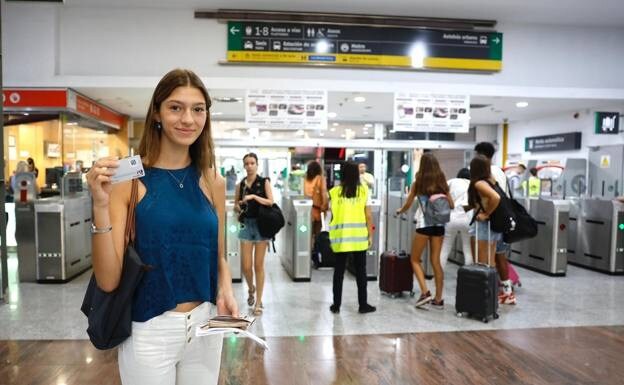 A passenger with one of the free travel passes at Malaga's María Zambrano station. 