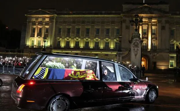 Queen Elizabeth II's coffin arrives at Buckingham Palace on Tuesday evening.