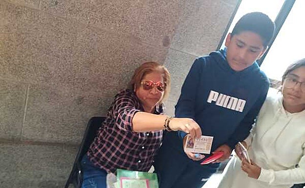 Perla, a woman at the draw at Madrid's Royal Theatre is among those who have won a share of the jackpot.