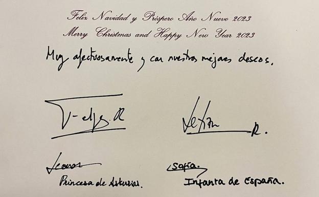 The greeting, in Spanish and English, inside the card