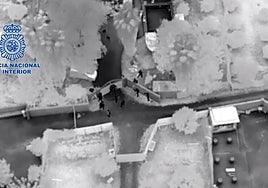 National Police officers enter the farm.