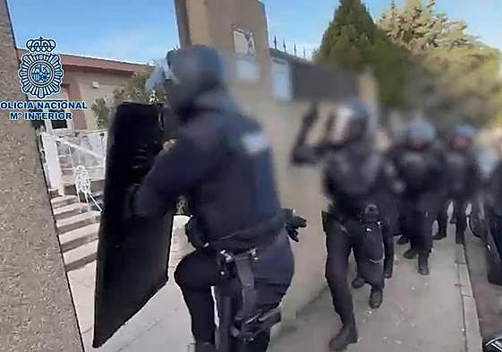 Police spring into action duing the drugs raid.